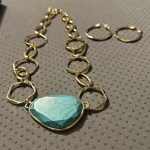 Beautiful gold necklace with hoop earrings